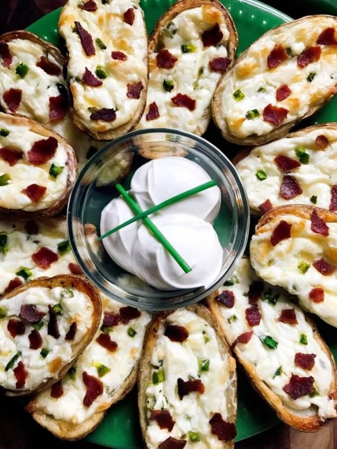 several jalapeno popper potato skins on a plate