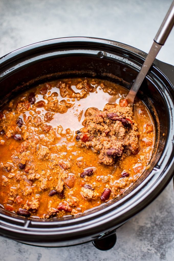 turkey chili in a slow cooker with ladle