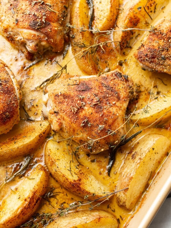 a sheet pan with chicken thighs and potatoes