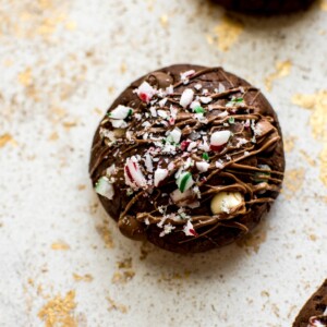 These easy, soft, and chewy peppermint chocolate brownie cookies are topped with crushed candy canes for a festive Christmas treat! They're made from Duncan Hines box mix to save time and effort during the busy holiday season.