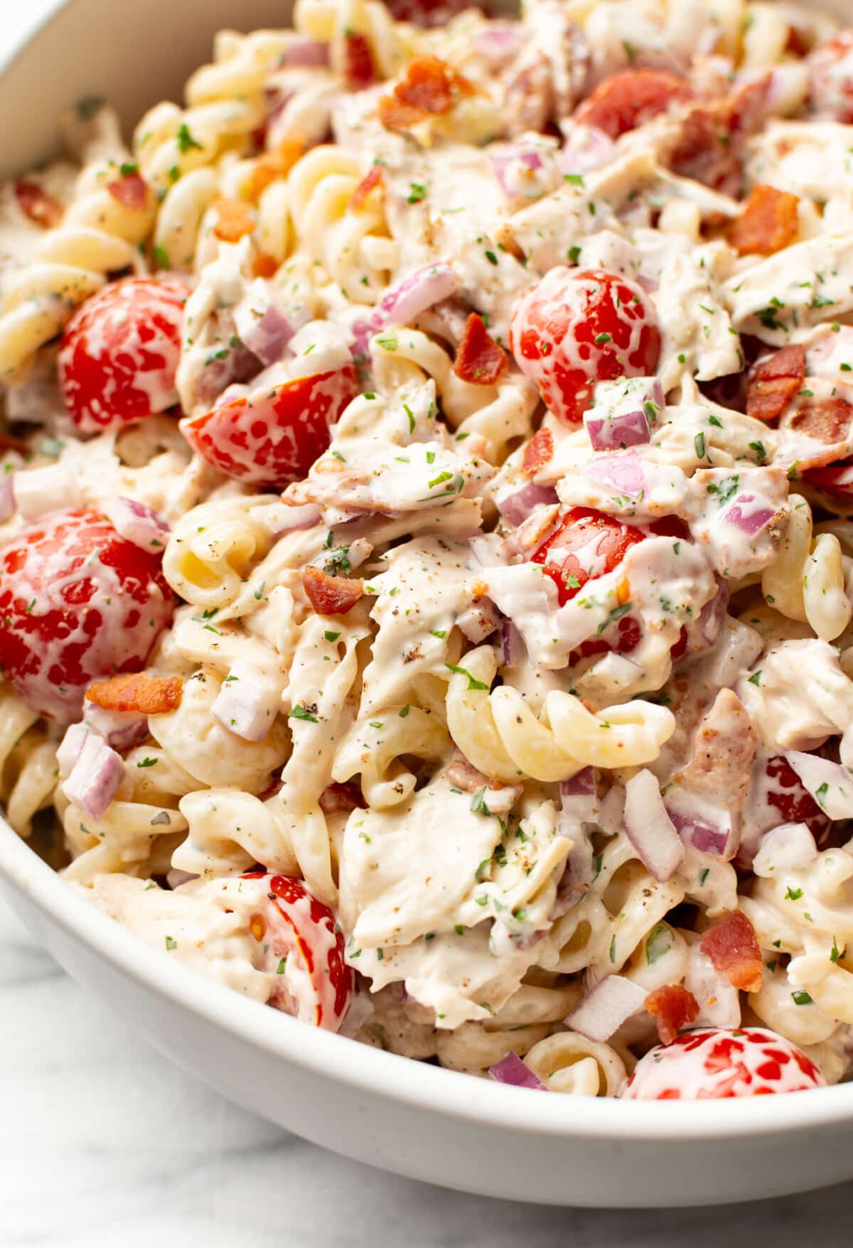 a bowl of chicken ranch pasta salad