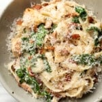 a bowl of chicken bacon spinach pasta
