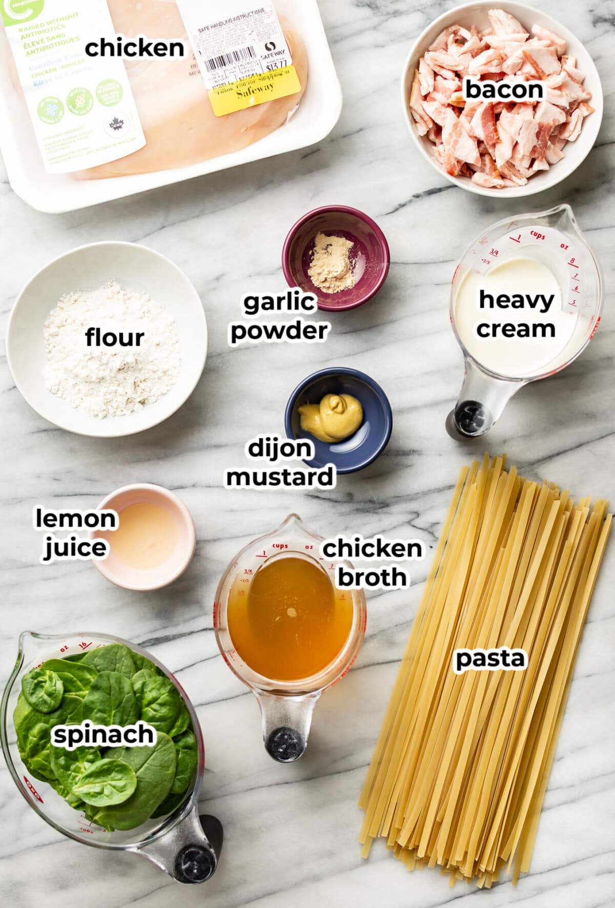 ingredients for chicken bacon spinach pasta in prep bowls