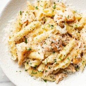 a bowl of garlic butter salmon pasta