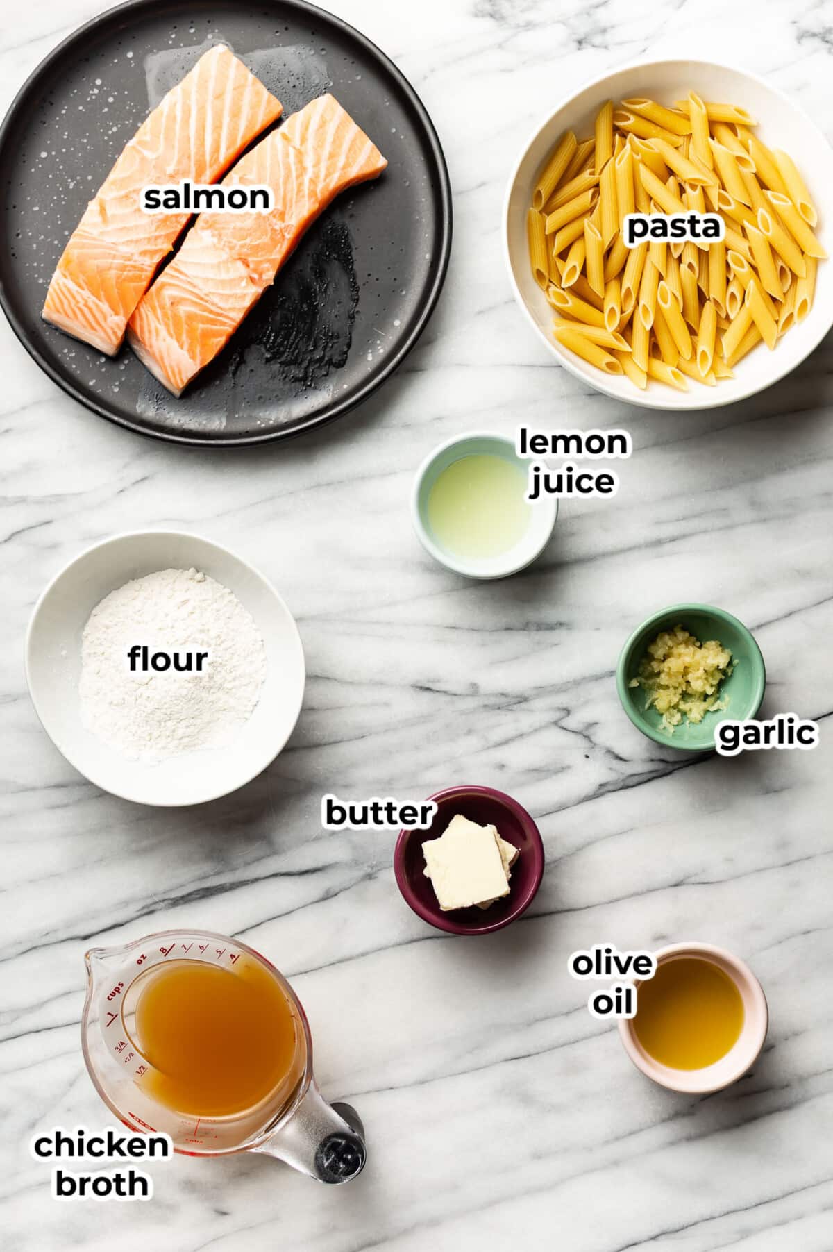 ingredients for garlic butter salmon pasta in prep bowls