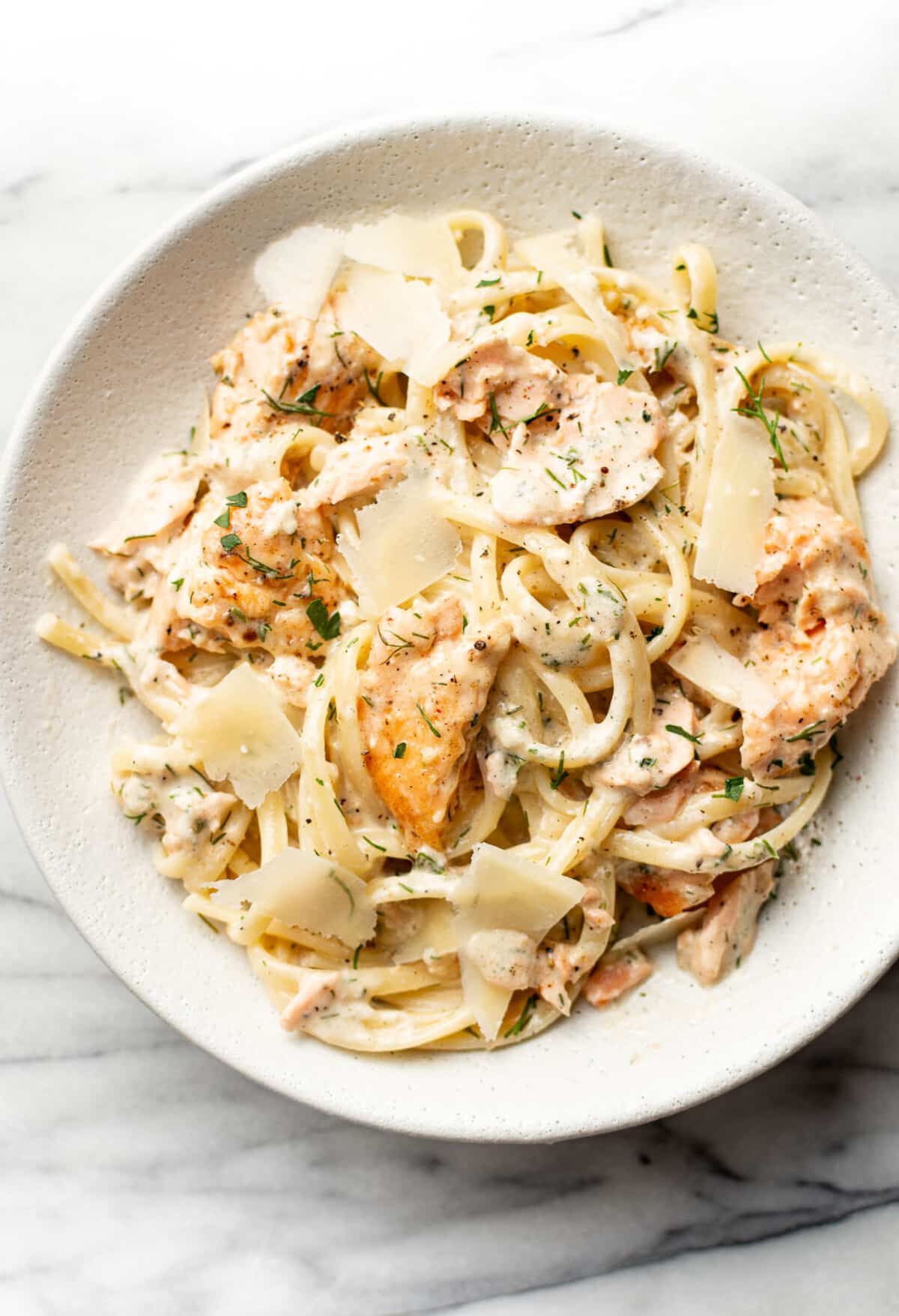 a bowl of lemon dill salmon pasta