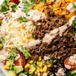 a bowl of taco salad with creamy salsa dressing