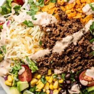 a bowl of taco salad with creamy salsa dressing