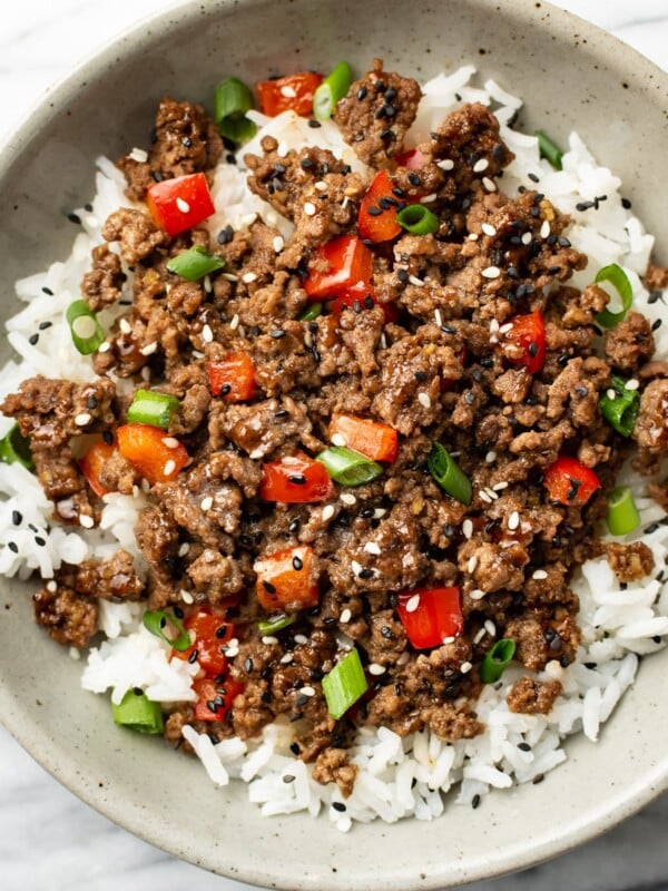 a bowl of asian inspired ground beef over rice