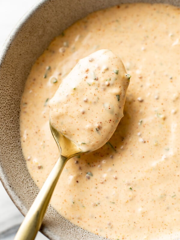 a bowl of remoulade sauce with a spoon