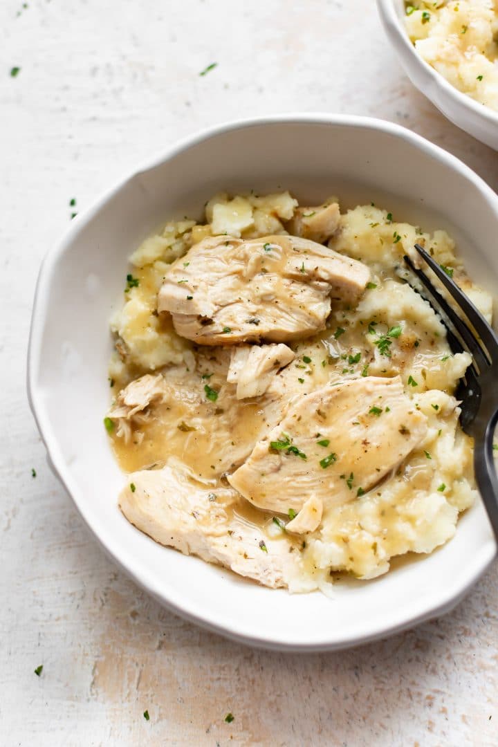 close-up of Instant Pot chicken and gravy served with mashed potatoes