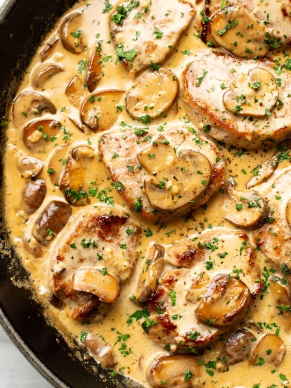 a skillet with creamy mushroom pork tenderloin