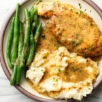 a plate with honey mustard chicken, green beans, and mashed potatoes