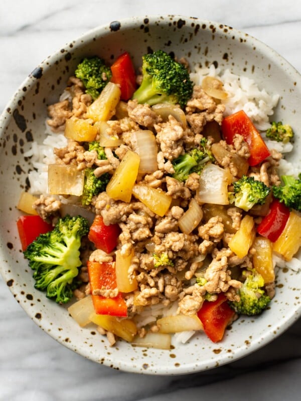 a bowl of ground pork stir fry over rice