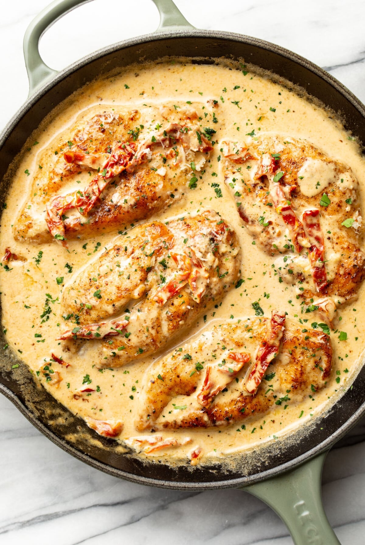 a skillet with creamy cajun chicken