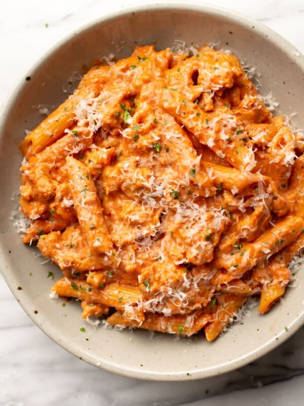 a bowl of italian sausage tomato pasta with parmesan