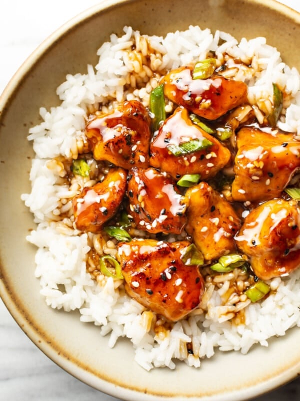 a bowl of teriyaki chicken over jasmine rice