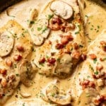 closeup of a skillet with creamy pancetta and mushroom chicken