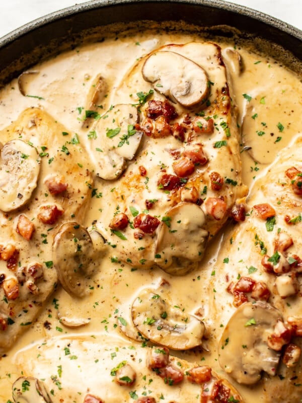 closeup of a skillet with creamy pancetta and mushroom chicken