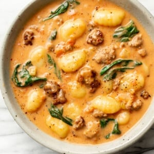 a bowl of creamy italian sausage gnocchi soup