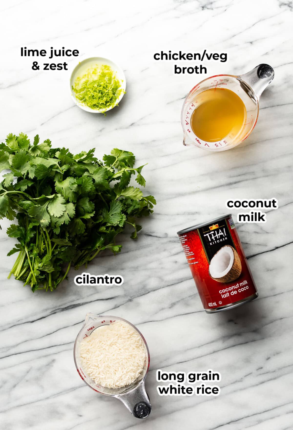 ingredients for coconut lime rice on a marble countertop