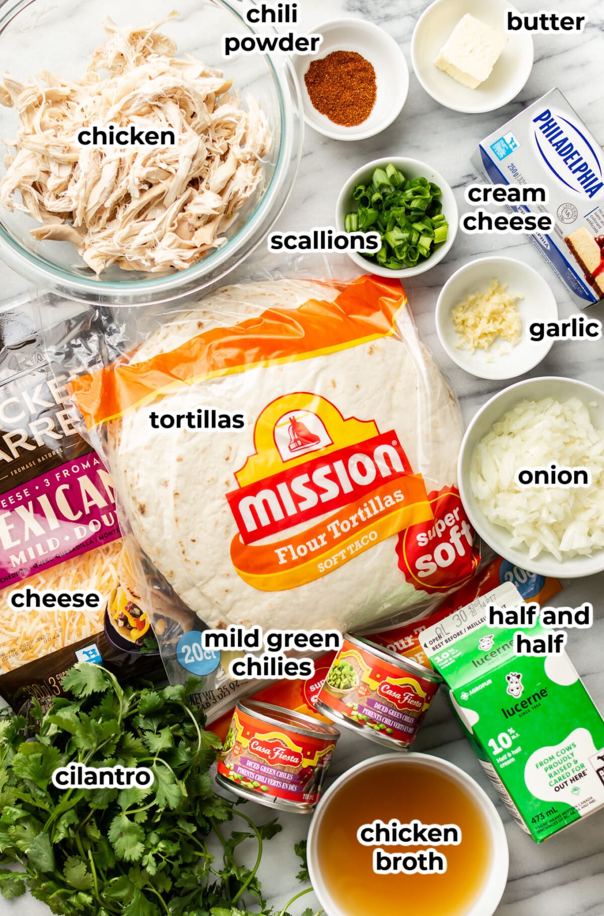 ingredients for chicken enchiladas in prep bowls