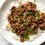 a bowl of mongolian ground beef over rice