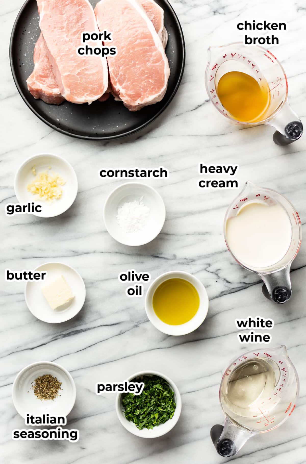 ingredients for creamy white wine pork chops in prep bowls