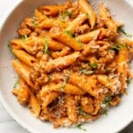 a bowl of penne alla vodka with sausage