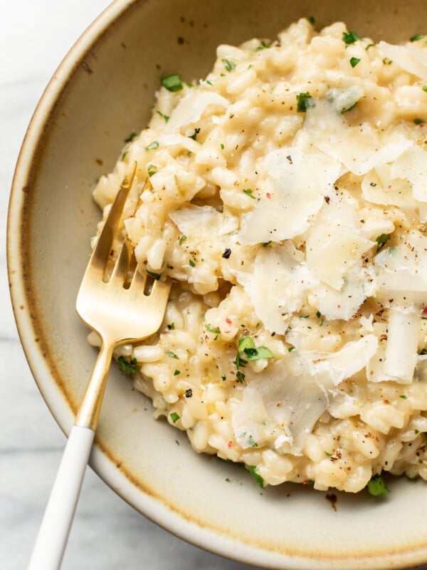 a bowl of risotto with a fork