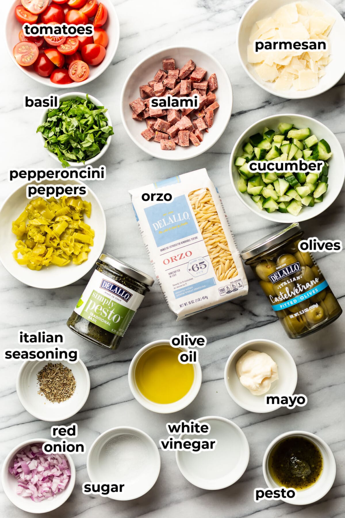 ingredients for italian orzo salad in prep bowls