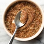 a bowl with homemade blackened seasoning and a spoon