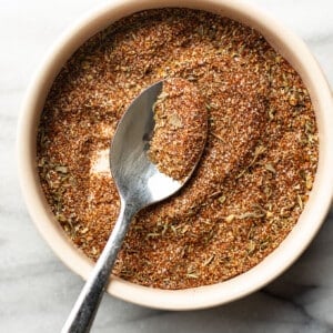 a bowl with homemade blackened seasoning and a spoon