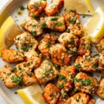 a plate with garlic butter salmon bites