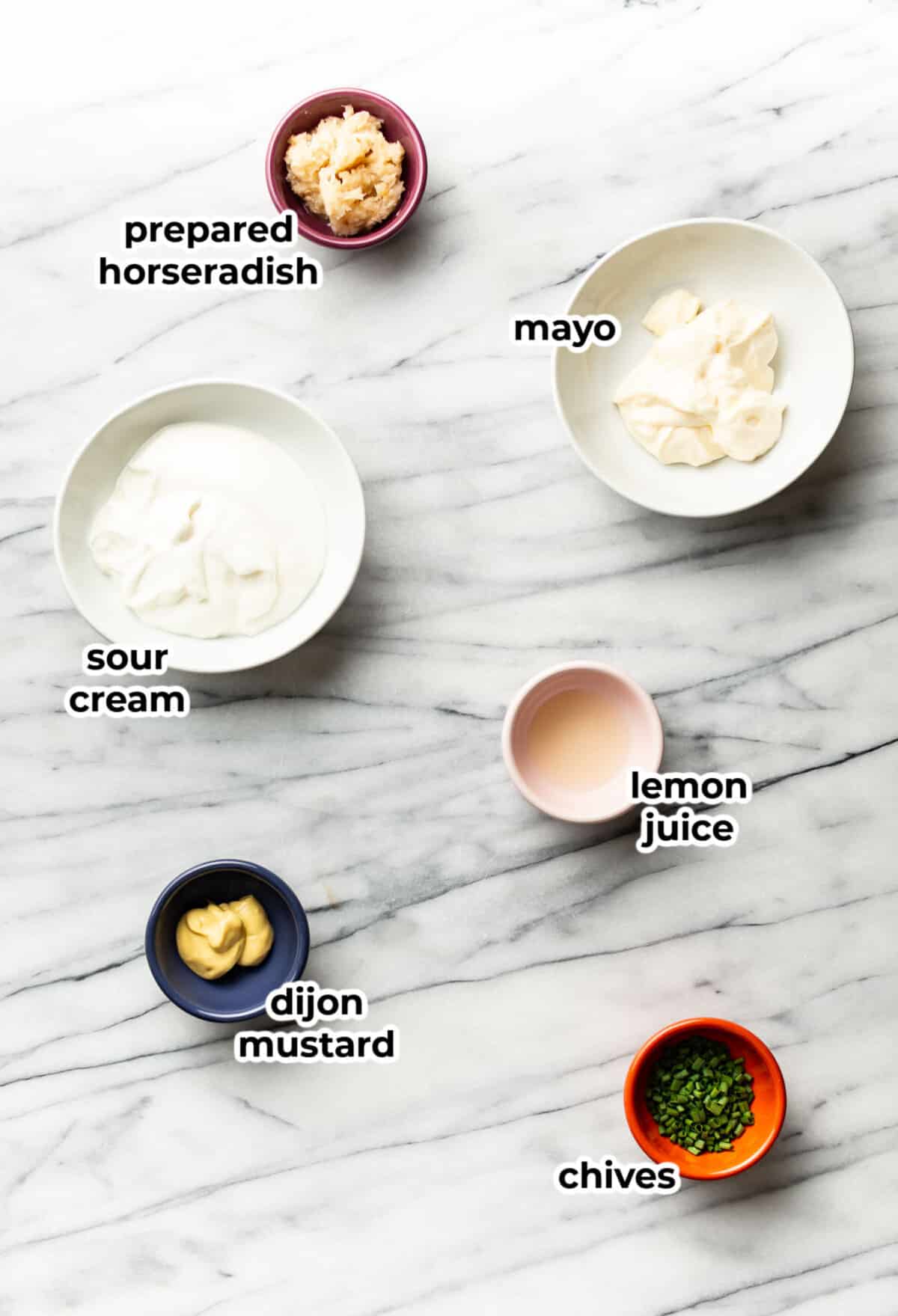 ingredients for creamy horseradish sauce in prep bowls