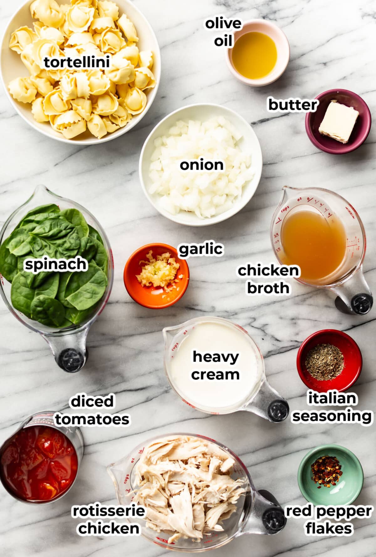 ingredients for one pan tortellini with chicken in prep bowls