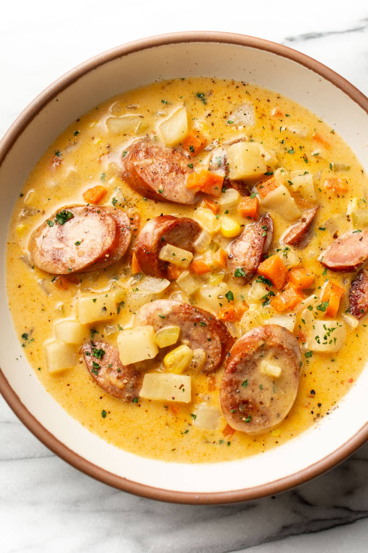 a bowl of creamy kielbasa and potato soup