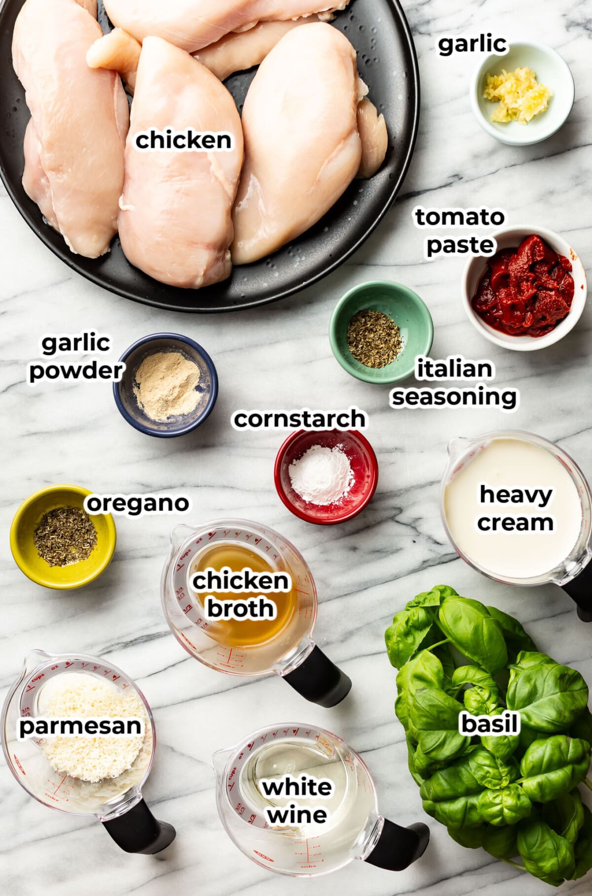 ingredients for baked tomato basil chicken in prep bowls