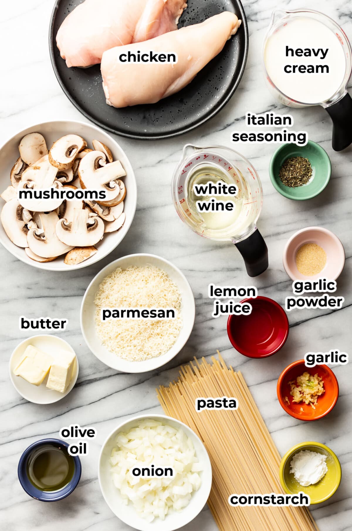ingredients for chicken mushroom pasta in prep bowls