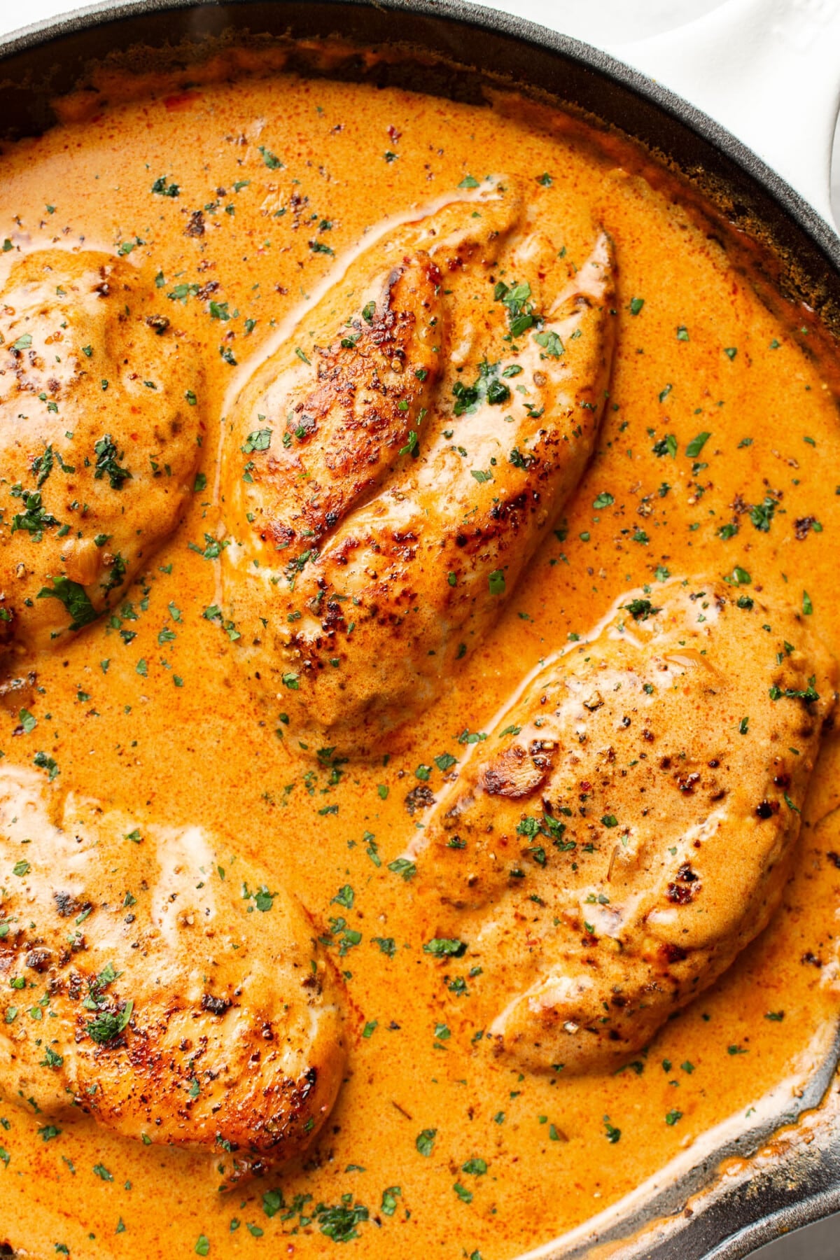a skillet with creamy paprika chicken