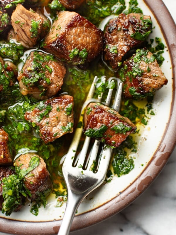 a plate with steak bites coated in gremolata