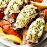 a plate with garlic butter lobster tails